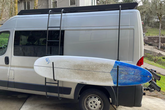 Orion promaster roof rack with surf board hooks and board pole on a 136 promaster van
