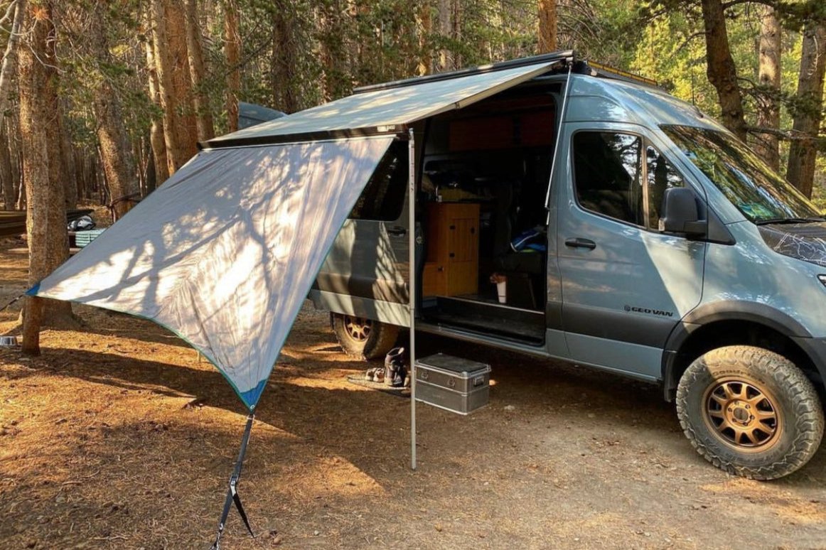 Awning Extension on a Sprinter van with a Fiamma F45s 300 awning. Green Trim, Blue Patches, Grey Tarp