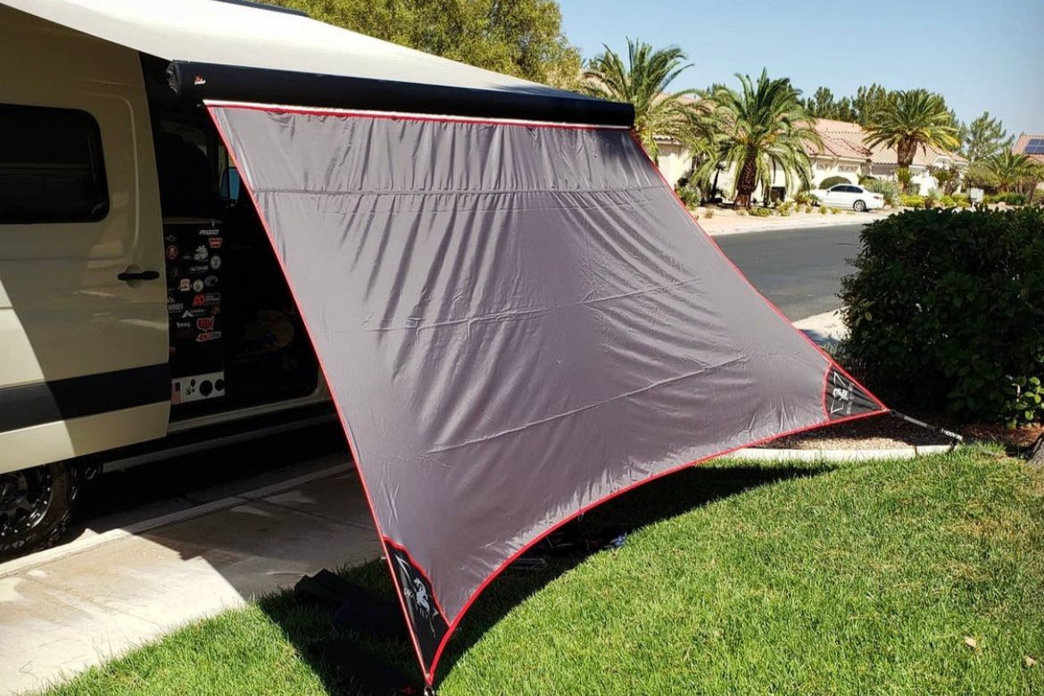 Awning Extesnion on a Winnebago Revel Carefree 9'6" awning. Red Trim, Black Patches, Grey Tarp