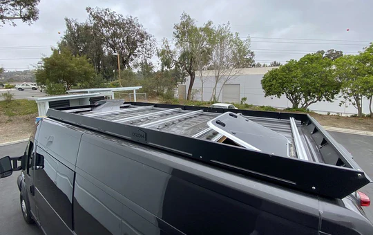 black promaster with stealth+ roof rack and marine hatch